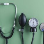 stethoscope lying near sphygmomanometer min 1